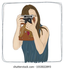 A young girl with a camera in her hands takes pictures.