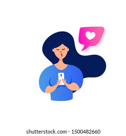 A young girl chatting using the chat application or social network on her mobile phone.