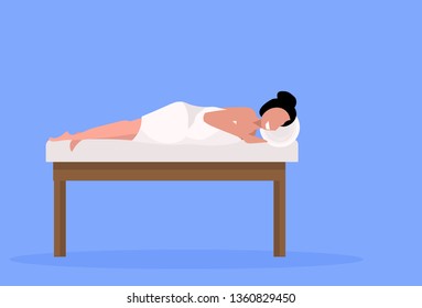 young girl client enjoying traditional massage patient woman lying on bed luxury spa and wellness center concept horizontal full length blue background