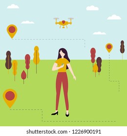 Young girl controls the drone outdoors