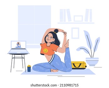 a young girl does yoga at home watching videos on a laptop