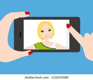 Young girl doing a selfie with smartphone