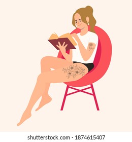 Young girl with flower tattoo reading a book.