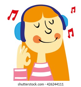 A young girl with ginger hair smiling and listening to music on a pair of headphones gives an okay sign with her hand