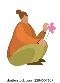 A young girl is guessing on a daisy