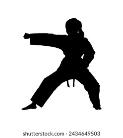 Young girl karate pose silhouette.	