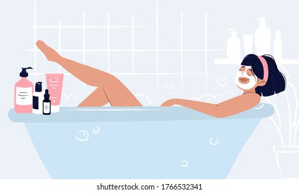 Young girl laying in bathtub with face mask doing hygiene and self care and enjoying her beauty ritual. Woman bathroom with cosmetics around: cream, mask, serum dropper bottle, hair spray and shower.