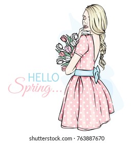 Young girl with long hair in a beautiful short dress. A bouquet of tulips. Vector illustration. Clothing, accessories, fashion and style. She's a slender woman.