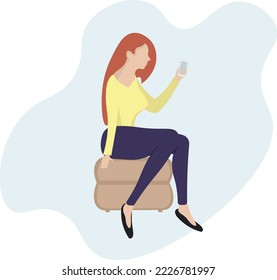 A young girl looks at the phone