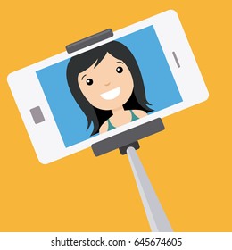 Young girl making a photo with selfie stick