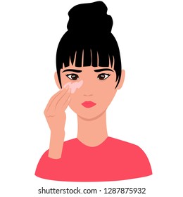 a young girl moisturizes the skin with cream. cosmetic skin care