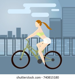  young girl on a sports bike going down the street