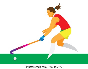 a young girl is a player in field hockey takes the ball