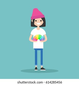 Young girl playing with  a plastic rainbow spring toy / flat editable vector illustration, clip art