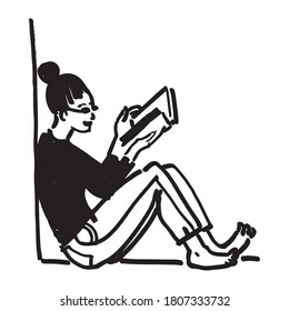 A young girl reading a book