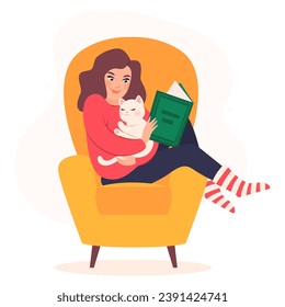 Young girl reading book and resting with  cat on comfortable yellow armchair. Cute woman read book. Nice leisure on weekends and holidays with interesting book