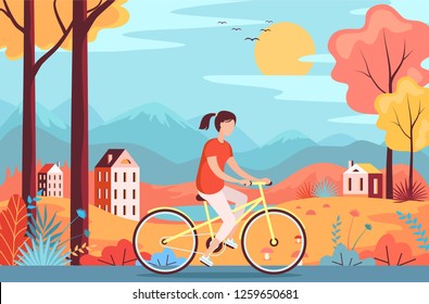 Young girl riding a yellow bicycle in autumn park