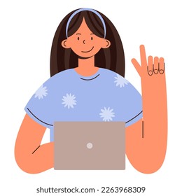 A young girl sits in front of a computer and shows a gesture when an idea comes up.