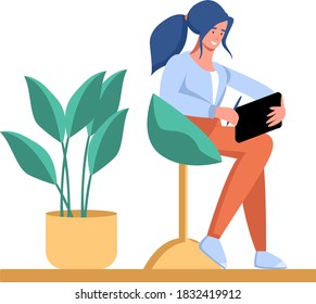 Young girl sitting on a chair with a tablet in her hands, remote work and study