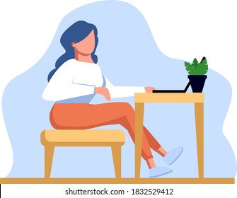 Young girl sitting on a stool at a Desk with a laptop