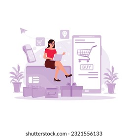 Young girl sitting and using a laptop, shopping online using a debit card. Trend Modern vector flat illustration.