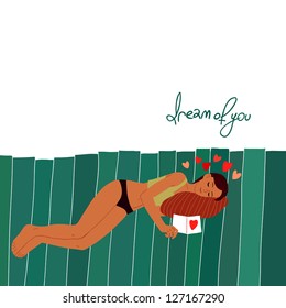 Young girl sleeping on a pillow with Valentine card