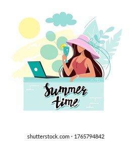 A young girl in a straw hat in summer drinks cocktail and sits at a laptop. Freelance work at sea