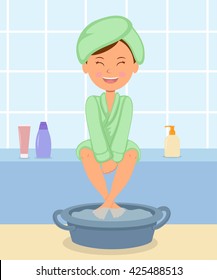 Young Girl Taking Spa Treatments. Female In The Bathrobe Keeps Feet In Hot Water Before A Pedicure.