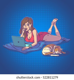 Young girl using laptop while lying on the floor