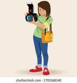 Young girl using a professional camera.