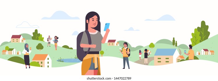 young girl using smartphone social network communication concept mix race people chatting online mobile messaging application countryside landscape background portrait flat horizontal