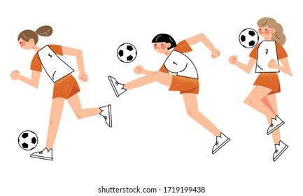 Young girls football players in uniform playing football outdoors in team