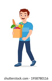 young good looking man carry bag full of grocery