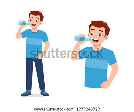 young good looking man drink water on bottle