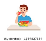 young good looking man eat fruit and vegetable