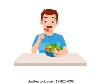 young good looking man eat fruit and vegetable