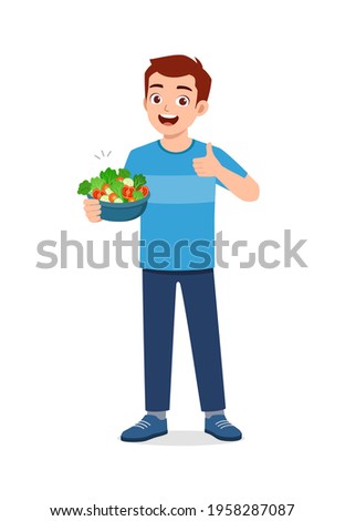 young good looking man eat fruit and vegetable