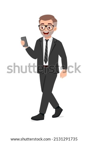 young good looking man walking and using phone