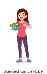 young good looking woman eat fruit and vegetable