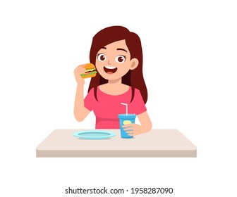 young good looking woman eat unhealthy fast food