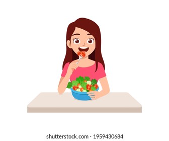 young good looking woman eat fruit and vegetable