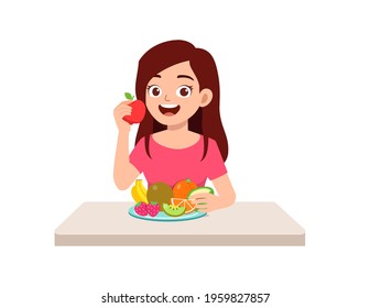 young good looking woman eat fruit and vegetable