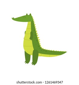 Young green cute cheerful crocodile spends his free time.