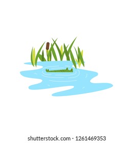 Young green cute cheerful crocodile spends his free time.