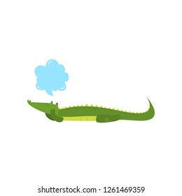 Young green cute cheerful crocodile spends his free time.