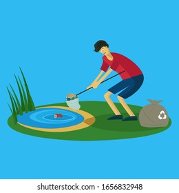 young guy cleans debris with water