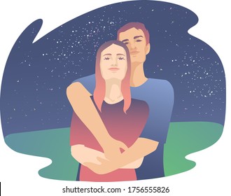 Young guy with a girl cuddling under the starry sky. Handsome man hugs a woman from behind, the two of them are looking at the sky.