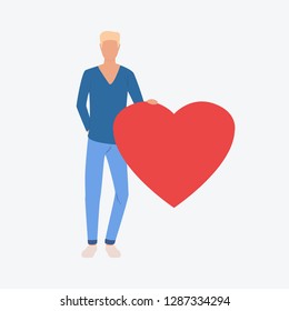 Young guy holding red heart. Romantic, boyfriend, greeting. Can be used for topics like Saint Valentines Day, festival, celebration