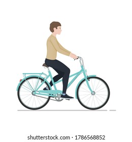 Un chico joven monta una bicicleta aislada sobre fondo blanco