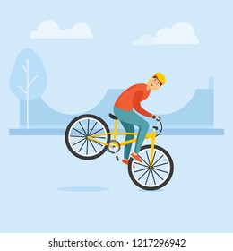 Young guy rides a bike and performs complex stunts.